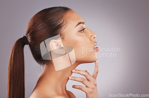 Image of Black woman neck, face profile and skincare with antiaging aesthetic for wellness and self care. Isolated, gray background and studio with person with healthy dermatology feeling skincare glow