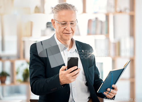 Image of Notebook, phone and senior business man in office for client contact, reading directory and planning schedule. Social media, networking and ceo on smartphone for mobile app, writing email and text