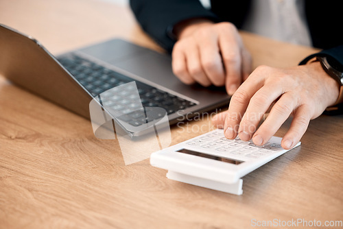 Image of Hands, laptop and calculator for finance, audit or statistics at office desk in costs, expenses or bills. Hand of financial advisor, accountant or person calculating profit in corporate management