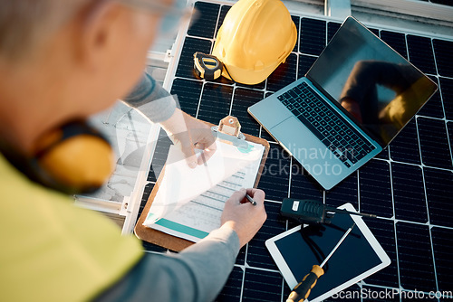 Image of Solar panels, planning and engineering hands with technology, checklist or insurance for installation. Energy saving, electricity and power technician with laptop, tools and maintenance management