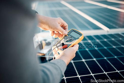 Image of Solar panels, multimeter and engineering hands for voltage check, installation or maintenance. Sustainability, eco friendly or energy saving technology, contractor inspection or troubleshooting tools