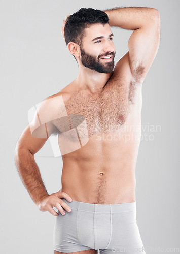 Image of Fitness, body and strong man in underwear for exercise, weight loss and wellness on a studio background. Aesthetic person for health, motivation and stomach or sexy muscle growth on healthy diet