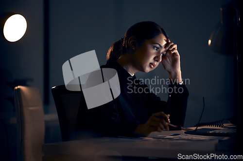 Image of Stress, night and business woman on computer working on project, planning and strategy deadline. Burnout, mental health and female worker thinking in dark office with headache, tired and overworked