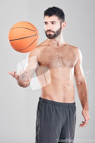 Image of Fitness, sport and man throwing basketball in air, topless sports player isolated on grey background. Exercise, motivation and training, male model with workout mindset and strong muscle in studio.