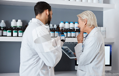 Image of Science, medicine and team with tablet in laboratory for vaccine, medical report and research. Pharmacy, healthcare and scientists reading label of medication for data analysis, results and study