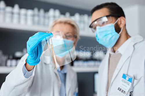 Image of Medical science, test tube and team in laboratory with face mask or ppe for research or analysis. Man and woman scientist or doctor hand for futuristic chemical or medicine innovation or development