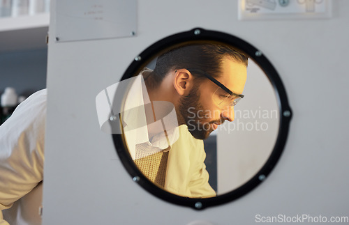 Image of Scientist, man with incubator and science experiment with medical research, biotechnology or ivf with innovation. Scientific study in laboratory, test sample storage and doctor face with researcher