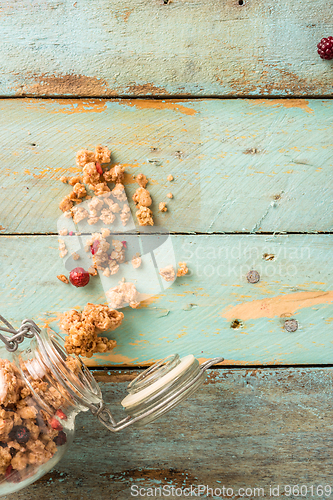 Image of Glass jar with healthy breakfast cereal 