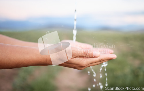 Image of Hands, water and washing or cleaning for hygiene, hydration and sustainability with a splash outdoors on a farm. Person, ecology and aqua to prevent germs or bacteria for care, wellness and health