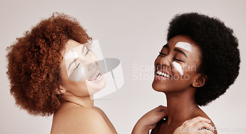 Image of Cream, face treatment and girl friends with black women and happiness for skincare and beauty in studio. Wellness, people and spa aesthetic with lotion and moisturizer for facial and cosmetic product