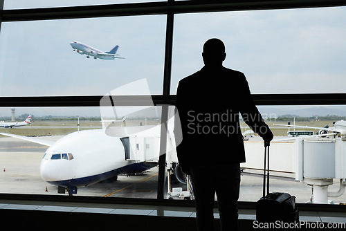 Image of Airport, travel and silhouette business man watch plane fly, flight booking or transportation for world trip. Suitcase luggage, airport departure and back of person on holiday, vacation or journey