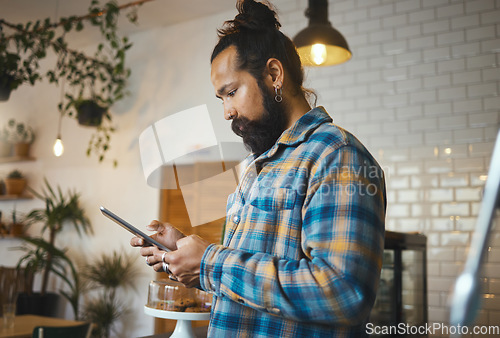 Image of Social media, search or cafe man with tablet for networking or company blog content review. Focus, manager or coffee shop hipster employee on tech typing for planning, research or internet mobile app