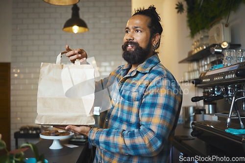 Image of Cafe, takeaway bag and cashier man or small business owner with sustainable restaurant in customer services. Costa Rica employee, waiter or person giving package, fast food delivery and startup store