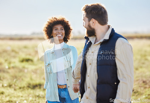 Image of Love, relax and holding hands with interracial couple on farm for agriculture, peace and growth. Trust, nature and hug with man and black woman in grass field for sustainability, agro and environment