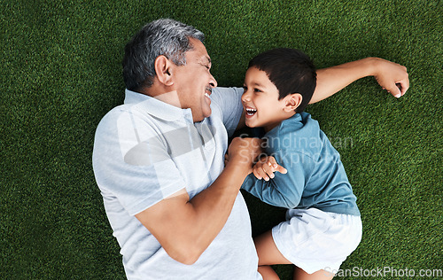 Image of Playful, laughing and grandfather and child in a garden for happiness, playing and cheerful together. Babysit, happy and senior man with a boy kid for quality time during a fun visit on grass