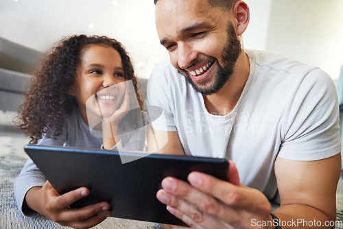 Image of Girl, father or bonding on tablet in house, home or floor for live streaming, watching movies or education social media. Smile, happy kid or man on technology for video call, children website or app