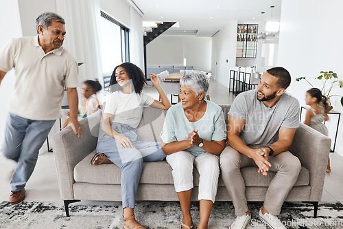 Image of Grandparents, parents and children in living room playing for bond, quality time and relax together. Big family, love and happy kids in action, running and fun with mom and dad, grandma and grandpa