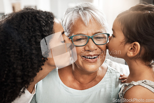 Image of Kiss, affection and children with grandmother for love, birthday or mothers day. Gratitude, care and an elderly woman with a baby and daughter kissing for appreciation, caring and loving at home