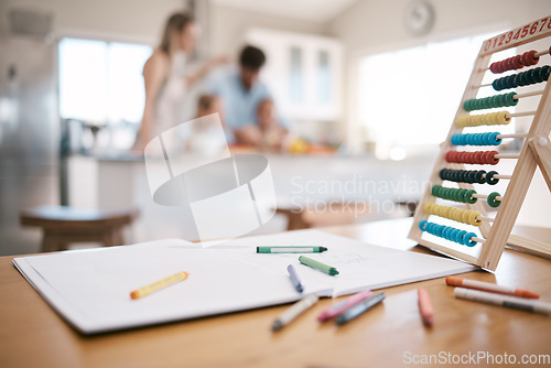 Image of Crayon, book and paper with education toys on table for child development, learning and knowledge. Family home, children and notebook for drawing, writing and color activity for kids in living room