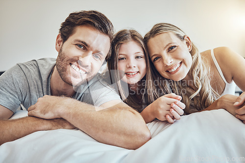 Image of Portrait, mother or father with a girl in bedroom relaxing as a happy family bonding in Australia with love or care. Morning, face or fun parents smile with kid enjoying quality time on a holiday