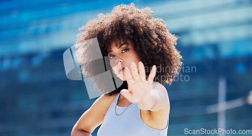 Image of Fitness, dance and black woman in urban city with energy, hand moving and energy portrait of gen z youth. Natural hair, afro and workout, exercise or hip hop person or model on blue building