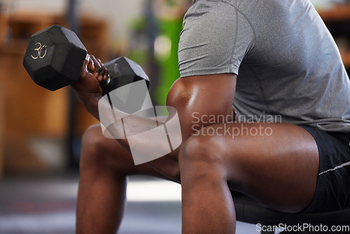 Image of Dumbbell, power and black man doing a workout in the gym for intense arm strength training. Sports, motivation and strong African male bodybuilder doing a exercise with weights in a sport center.