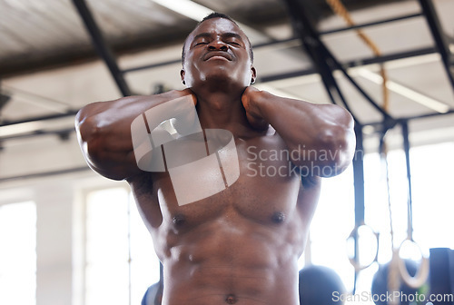 Image of Fitness, neck pain and man with injury at gym for exercise, training and cardio on blurred background. Sports, accident and black guy with muscle, joint or spine inflammation during workout routine