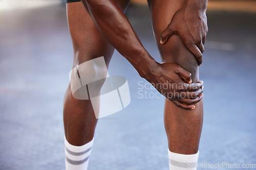 Image of Knee pain, hands and man at gym with injury, hurt or sore during fitness, training and exercise on mockup space. Sports, accident and legs of guy with muscle, arthritis or inflammation during workout