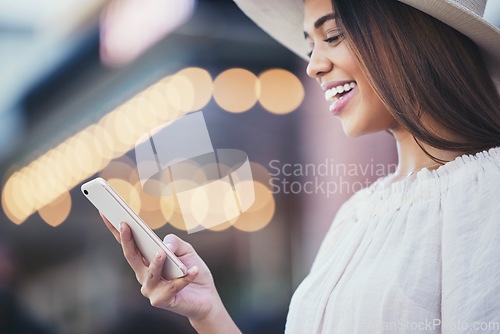 Image of Woman, phone and smile for social media with in the city for communication, travel or conversation. Happy female smiling for discussion, traveling or online 5G connection on smartphone in urban town
