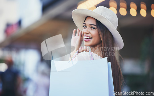 Image of Woman, shopping bag and portrait smile in the city carrying bags for discount, deal or purchase. Happy female shopper smiling in joyful happiness for luxury, fashion gifts or sale in an urban town