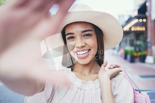 Image of Woman, vlogger and smile for selfie in the city for shopping, travel or profile picture and memories. Happy female influencer or shopper smiling for vlog, traveling or 5G connection in an urban town