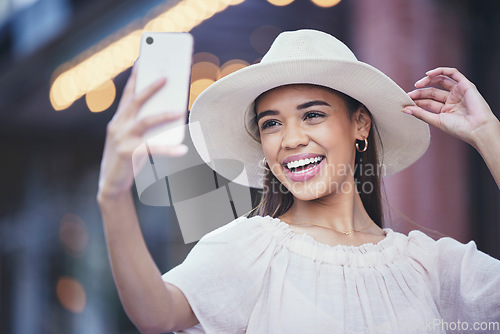 Image of Woman, social media and smile for selfie in the city for vlogging, travel or profile picture and memories. Happy female influencer smiling for vlog, traveling or online 5G connection in an urban town