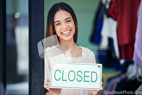 Image of Business owner, holding and portrait of a woman with a sign for a closed shop in the afternoon. Smile, entrepreneur and retail employee showing a board for a store closure, advertising and news