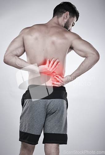 Image of Fitness, hands or sports man with back pain after exercise, body training injury or gym workout with injured muscle. Red glow, spine or bodybuilder suffering alone isolated on studio background