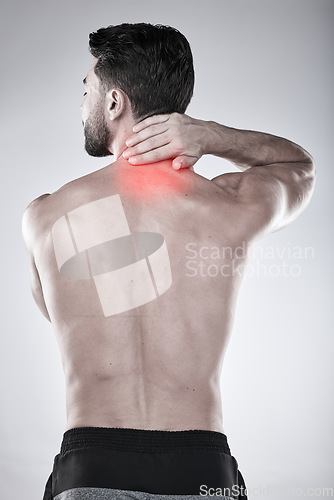 Image of Fitness, hand or sports man with neck pain after exercise, body training injury or gym workout with injured muscle. Red glow, back view or stressed bodybuilder suffering isolated on studio background