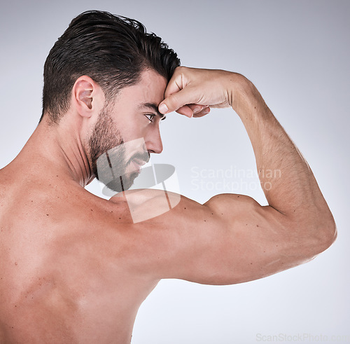 Image of Arm muscle, man flex with face profile, body with health and fitness, strong person isolated on studio background. Skin, bodybuilder and biceps, wellness and weightlifting with growth from exercise