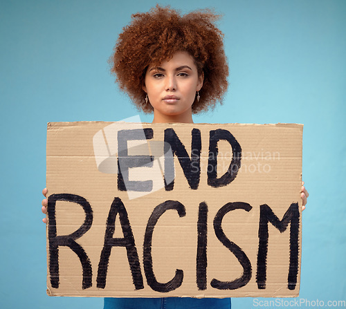 Image of Poster, political and portrait of a woman in a studio for a protest for racism, equality and human rights, Freedom, social justice and female from Mexico with a sign for a rally by a blue background.