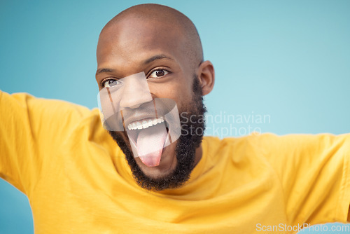 Image of Black man, portrait or tongue on blue background, isolated mockup or wall backdrop mock up for comic, silly or emoji expression. Happy, funny face or goofy student with fashion, trend or cool clothes