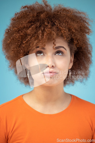 Image of Comic, thinking and face of woman on blue background with ideas, vision and looking up in studio. Fashion mockup, thoughtful and emoji facial expression of confused girl with attitude and mindset