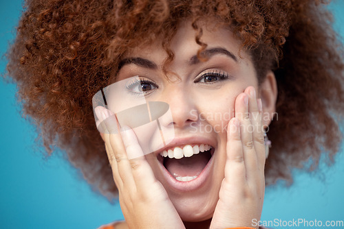 Image of Wow, surprise and portrait of a happy woman in a studio with mockup space for sale, deal or discount. Happiness, scream and female model with excited and shocked facial expression by blue background.