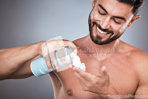 Image of Hands, shaving cream and man with product in studio isolated on a gray background for hair removal. Skincare, face and happy male model with facial foam to shave for epilation, health and hygiene.