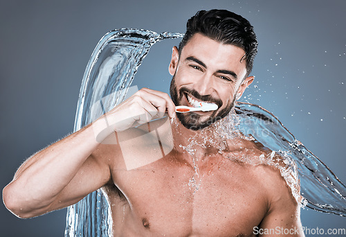 Image of Water splash, brushing teeth and portrait of happy man with toothbrush, dental wellness and healthy mouth care. Wet male model, oral cleaning and fresh breath for smile, happiness or shower cosmetics