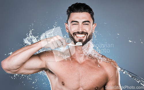 Image of Water splash, brushing teeth and portrait of man with toothbrush, dental wellness and healthy mouth care. Happy male model, oral cleaning and fresh breath for smile, happiness and shower cosmetics