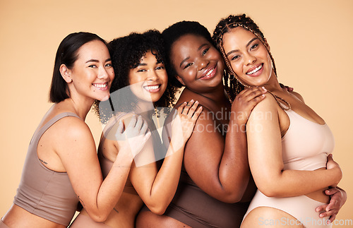 Image of Skin care, portrait and diversity women group together for inclusion, natural beauty and power. Happy plus size model friends on beige background for support, makeup glow and underwear body self love