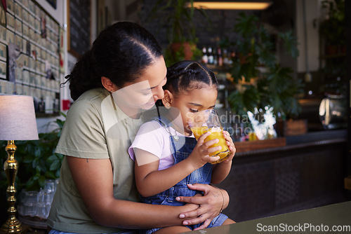 Image of Coffee shop, black family and hug with a mother and daughter enjoying a beverage in a cafe together. Hugging, caffeine and love with a young woman and happy female child bonding in a restaurant