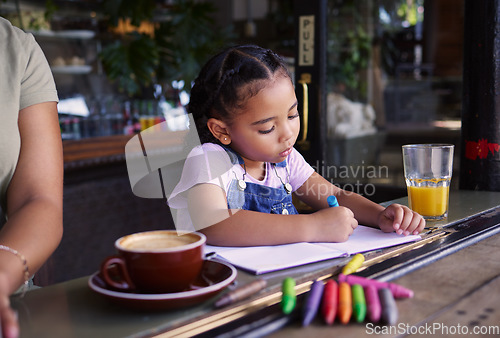 Image of Girl child color in book at cafe, creative and drawing with crayons, family day to relax with learning and art in Atlanta. Young kid, growth and writing, education and creativity while at coffee shop