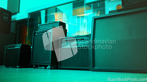 Image of Vintage, retro and old speakers or music equipment in studio or room with neon blue light for entertainment. Stereo, record and audio tools or loudspeaker with volume and sound as 90s technology