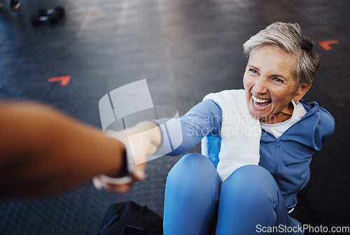 Image of Senior woman, fitness and personal trainer with support and happy workout, exercise and muscle health on gym floor. Helping hand, coaching and elderly person with training sports for retirement care