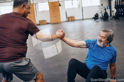 Image of Teamwork, support and helping hands of friends in gym after workout, exercise and training. Sports, get up and senior men help, collaboration and team work while exercising for health and wellness.