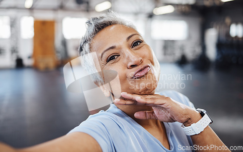 Image of Selfie, pout and wellness senior woman taking picture in the gym after exercise, workout or training. Elderly, old and portrait of a fit female happy for health and fitness on social media